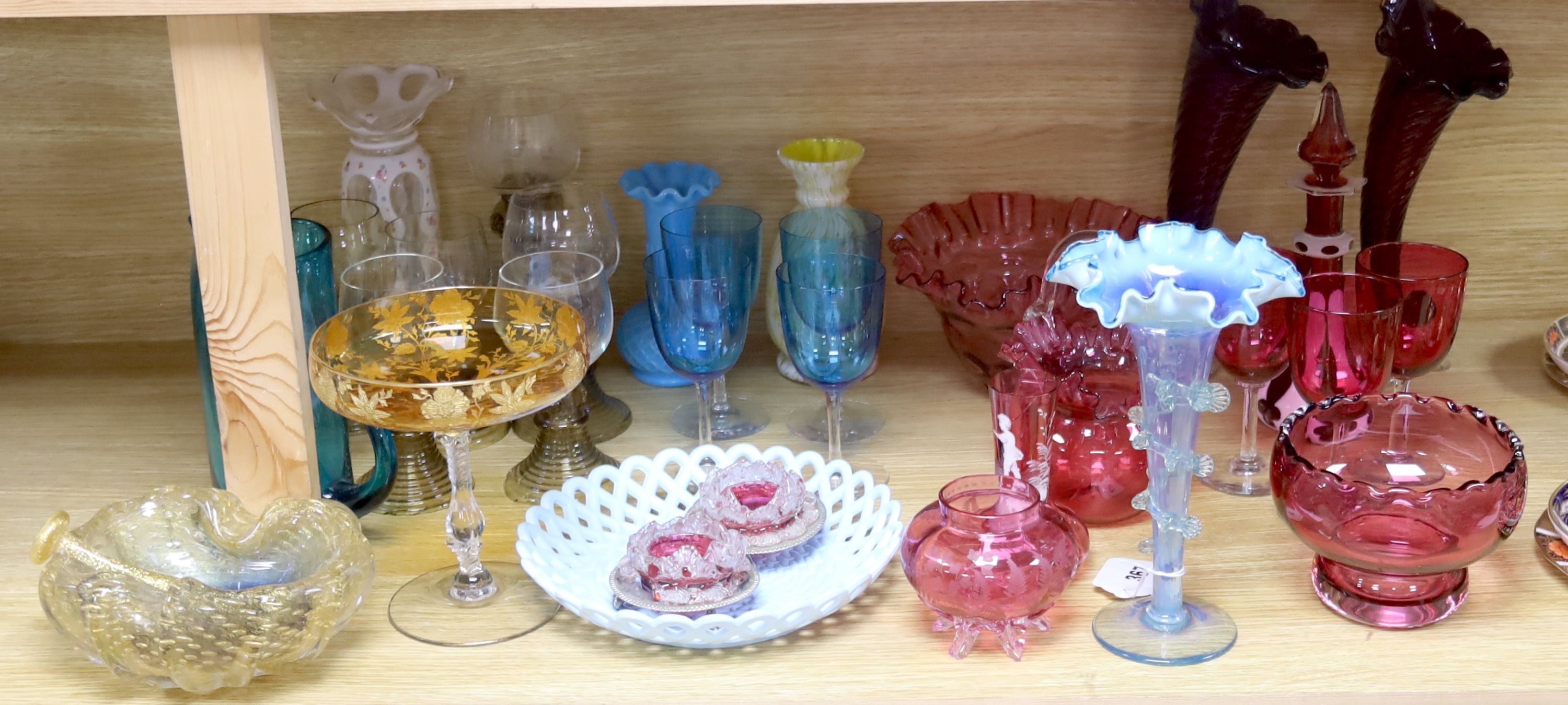 An assortment of 19th century and later coloured glassware including cranberry, Bohemian, Venetian etc.